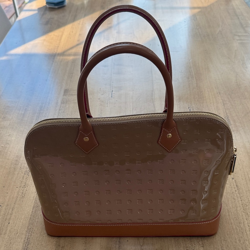 Arcadia patent leather tan bag, elegant red trimming